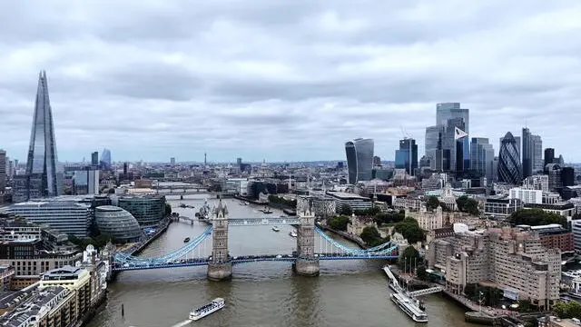 epa11550145 A picture taken with a drone shows the Tower Bridge and skyline of the financial district of the City of London in London, Britain, 15 August 2024. According to the Office for National Statistics (ONS), Britain's economy grew by 0.6 percent between April and June 2024, slowing down compared to the first quarter. Services were the biggest contributor to the country's economy, outstripping both manufacturing and construction. EPA/NEIL HALL