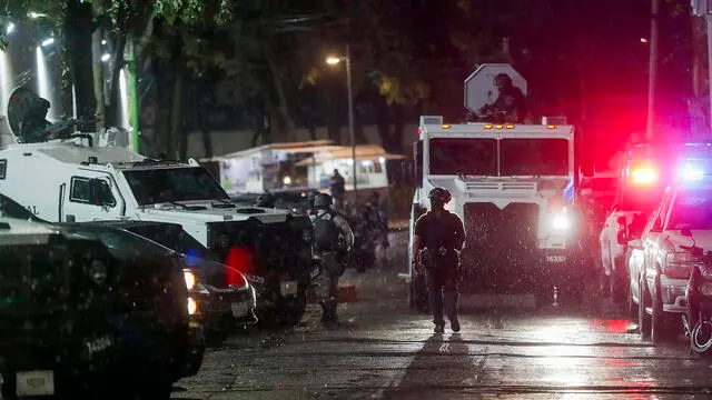epa10990357 A security convoy transferring Nestor Isidro Garcia 'El Nini', alleged head of security of Los Chapitos criminal group, arrives at the headquarters of the Specialized Prosecutor's Office for Organized Crime (Femdo) in Mexico City, Mexico, 22 November 2023. The Secretariat of Security and Citizen Protection (SSPC) of Mexico reported that the head of security of the Los Chapitos group, made up of the four sons of drug trafficker Joaquin 'El Chapo' Guzman, was arrested by agents of the Secretariat of National Defense (Sedena) in Sinaloa state capital Culiacan. EPA/Isaac Esquivel