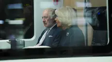 epa10552039 Britain's King Charles III (L) and Queen Consort Camilla (R) sit in a train to Hamburg at the central station in Berlin, Germany, 31 March 2023. King Charles III is on a three-day visit to Germany, his first state visit abroad as a monarch. EPA/FlashPic / POOL