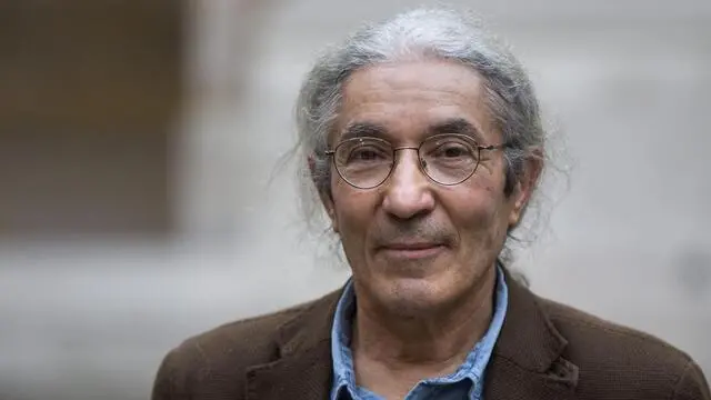 epa05002428 The laureate of the French Academy Literary Prize 2015, Algerian author Boualem Sansal for his novel '2084' poses at the French Academy in Paris, France, 29 October 2015. The French Academy Literary Prize celebrates its 100 years of existence. EPA/ETIENNE LAURENT