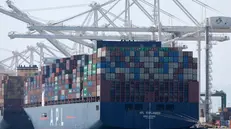 epa12156380 A sailboat passes by a container ship at the Port of Oakland in Oakland, California, USA, 04 June 2025. According to the Port of Oakland, container volume dropped 14.7 percent in April 2025, primarily due to market uncertainty and the impact of tariffs. The slowdown in shipping activity is raising concerns about job stability and and the regionâ€™s economic health. EPA/JOHN G. MABANGLO