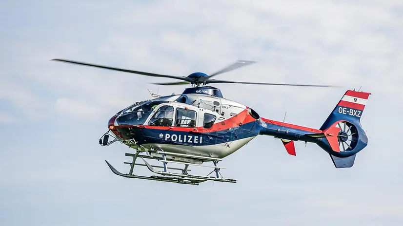 epa11688897 A police helicopter is dispatched as part of the search for a suspect after a shooting incident in Kirchberg ob der Donau, Austria, 28 October 2024. Police in Kirchberg ob der Donau in the northern Austrian state of Upper Austria have been conducting a major operation since the morning of 28 October 2024. A spokeswoman for the state police confirmed that a man is suspected of having shot dead two people, including the mayor of Kirchberg. The suspect is still on the run. EPA/ANTONIO BAYER