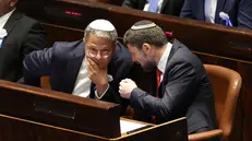 epa10307044 Israeli right wing Knesset member Itamar ben Gvir (L) and Bezalel Smotrich (R) during the swearing in ceremony of the new Israeli government, the 25th Knesset in Jerusalem, 15 November 2022. EPA/ABIR SULTAN / POOL