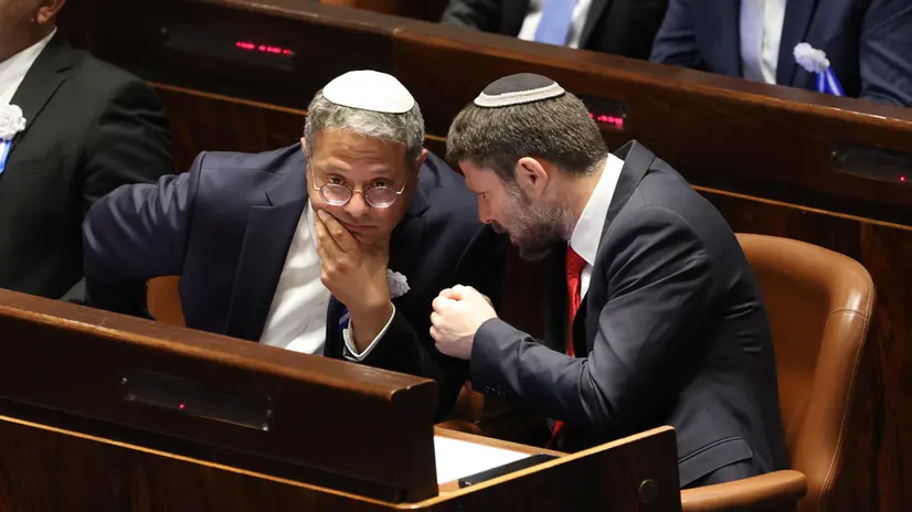 epa10307044 Israeli right wing Knesset member Itamar ben Gvir (L) and Bezalel Smotrich (R) during the swearing in ceremony of the new Israeli government, the 25th Knesset in Jerusalem, 15 November 2022. EPA/ABIR SULTAN / POOL