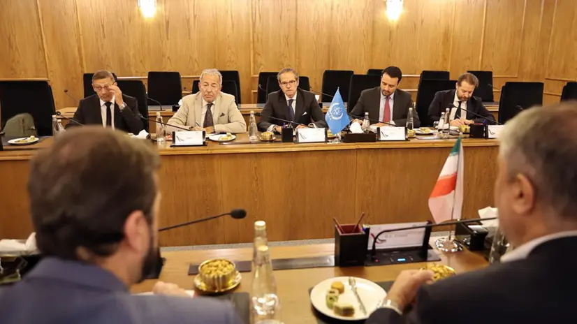 epa12036262 A handout photo made available by the Atomic Energy Organization of Iran (AEOI) office shows International Atomic Energy Agency (IAEA) Director General Rafael Grossi (C, back) reacting during a meeting with head of the Atomic Energy Organization of Iran (AEOI) Mohammad Eslami (R), in Tehran, Iran, 17 April 2025. Grossi is in Tehran to meet with Iranian officials following Iran and US nuclear talks. EPA/AEOI / HANDOUT HANDOUT EDITORIAL USE ONLY/NO SALES