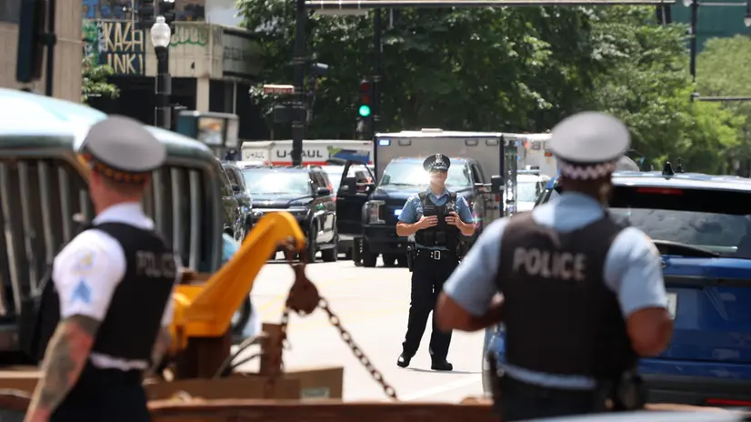 epa11513557 Police patrol outside of the Hilton Hotel before former US President and 2024 Republican Presidential nominee Donald Trump is to speak in Chicago, Illinois, USA, 31 July 2024. Trump spoke to the National Association of Black Journalists at their annual convention. EPA/ALEX WROBLEWSKI