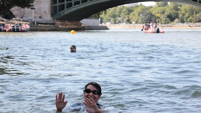 epa11483068 Paris Mayor Anne Hidalgo swims in the Seine to demonstrate that the river is clean enough to host the outdoor swimming events at Paris 2024 Olympic Games, in Paris, France, 17 July 2024. Despite an investment of 1.4 billion euros ($1.5 billion) to prevent sewage leaks into the waterway, the Seine has been causing suspense in the run-up to the opening of the Paris Games on 26 July, after repeatedly failing water quality tests. According to the Paris city hall on 12 July, the Seine has been clean enough for swimming for most of the past 12 days. EPA/JOEL SAGET / POOL MAXPPP OUT