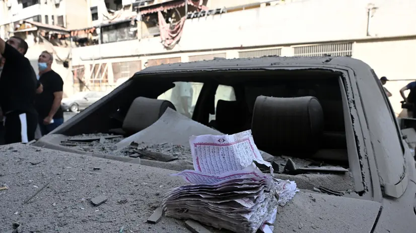 epaselect epa12159584 A book lies over a damaged vehicle following an Israeli airstrike in the Dahieh district in southern Beirut, Lebanon, 06 June 2025. The Israel army stated the renewed strikes in the southern suburb of Beirut were carried out against alleged Hezbollah drone facilities established in civilian neighborhoods. EPA/STRINGER