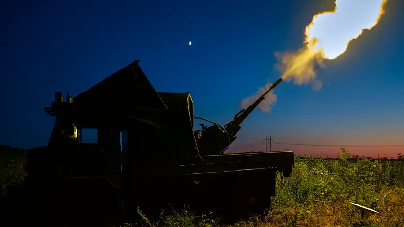 epa12212755 Ukrainian servicemen from the anti-drone mobile fire team shoot at a Russian drone flying toward Kharkiv, with a ZU-23 anti-aircraft twin-barreled autocannon in the Kharkiv region of Ukraine, late evening of 02 July 2025 (issued on 03 July 2025), amid the ongoing Russian invasion. EPA/SERGEY KOZLOV