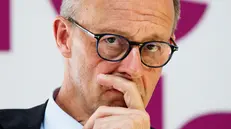 epa12210279 German Chancellor Friedrich Merz listens during a conference of female leaders Chef:innensache Jahreskonferenz 2025: Future Leaders in Berlin, Germany, 02 July 2025. EPA/CLEMENS BILAN