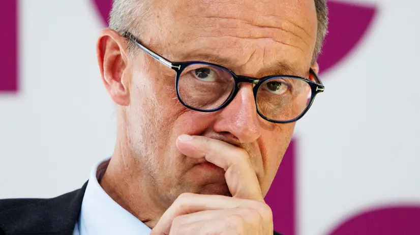 epa12210279 German Chancellor Friedrich Merz listens during a conference of female leaders Chef:innensache Jahreskonferenz 2025: Future Leaders in Berlin, Germany, 02 July 2025. EPA/CLEMENS BILAN