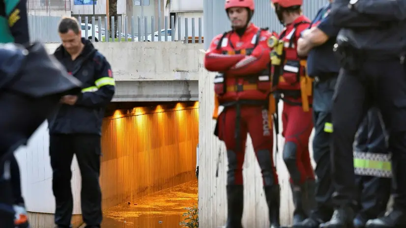 epa07838856 Members of the Special Groups of Underwater Activities (GEAS) and firemen work at the scene where a man has died after his vehicle get trapped in a flooded tunnel in Almeria city, southeastern Spain, 13 September 2019. With this victim, the number of dead people for the 'gota fria' (cold drop) phenomenon in the Mediterranean coast has risen to three. The eastern regions of Valencia and Alicante continue under red level alert due to torrential rains while the State Meteorological Agency AEMET has reduced the alert in Murcia to orange level. EPA/Carlos Barba