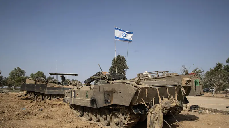 epa10995840 Military vehicles of the Israeli Defence Forces (IDF) stand in a base camp at the border with the Gaza Strip, in southern Israel, 26 November 2023. Israel and Hamas had agreed to a four-day ceasefire mediated by Qatar, the USA, and Egypt, that came into effect on 24 November and includes a deal for the release of people held by Hamas in the Gaza Strip in exchange for Palestinians detained in Israeli prisons. Thousands of people have died since Hamas militants launched an attack against Israel from the Gaza Strip on 07 October, and the Israeli operations in Gaza and the West Bank which followed it. EPA/CHRISTOPHE PETIT TESSON