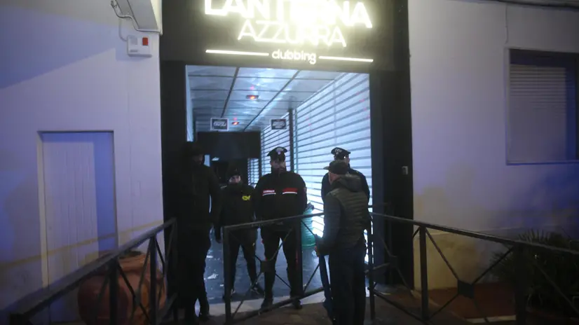 Carabinieri officers stand at the entrance of the nightclub 'Lanterna Azzurra' in Corinaldo, near Ancona, central Italy, 08 December 2018. A stampede that occurred overnight outside the nightclub killed six people and injured more than 100, after someone probably caused a panic with a stinging spray. The incident took place at the packed club hosting a concert by popular Italian rapper Sfera Ebbasta. ANSA/ STRINGER