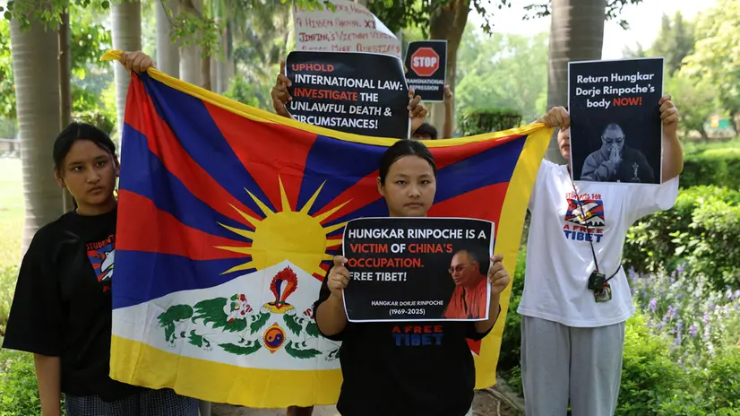 epa12031160 Activists from the Students for a Free Tibet (SFT) organization hold placards as they protest outside the Vietnamese embassy in New Delhi, India, 14 April 2025. SFT activists protest against the death of Tulku Hungkar Dorje, a revered Tibetan religious leader, under unclear circumstances while in detention in Vietnam. They call for a transparent and independent investigation into the circumstances of his death and the public release of its findings. EPA/RAJAT GUPTA