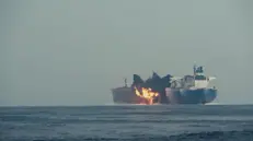 epa11640341 A handout screenshot of footage made available on 03 October 2024 by the Houthis media center shows flames and smoke rising from an explosion at the British oil ship Cordelia Moon after an attack by an unmanned Houthi exploding boat in the Red Sea, 01 October 2024. Yemen's Houthis launched on 01 October 2024 an unmanned exploding boat attack against the British oil ship Cordelia Moon in the Red Sea, according to a statement by Houthi military spokesman Yahya Sarea. EPA/HOUTHIS MEDIA CENTER / HANDOUT HANDOUT HANDOUT EDITORIAL USE ONLY/NO SALES