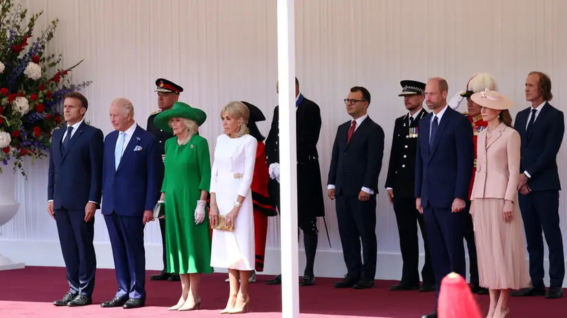epa12224378 (L-R, front row) French President Emmanuel Macron, Britain's King Charles III, Queen Camilla, French First Lady Brigitte Macron, Britain's Prince William and Catherine, Princess of Wales attend a welcome ceremony in Windsor, Britain, 08 July 2025. French President Macron and his wife Brigitte are on a three-day state visit to Britain. EPA/ANDY RAIN
