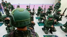 epa12225829 Taiwanese military reservists conduct pre-combat training during the annual Han Kuang military exercises in Miaoli County, Taiwan, 09 July 2025. The Taiwanese Armed Forces began the annual Han Kuang exercises, large-scale military drills aimed at testing the troops' defensive capabilities in the event of a potential invasion by China. Han Kuang military exercises are scheduled between 09-18 July. EPA/RITCHIE B. TONGO