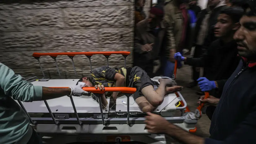 epa11813690 A wounded Palestinian boy is taken to Al Aqsa Martyrs Hospital in Deir Al Balah, central Gaza Strip, 08 January 2025. According to the Palestinian Ministry of Health in Gaza, at least five Palestinians were killed and more than 12 others injured after an Israeli airstrike hit Deir Al Balah refugee camp in central Gaza. More than 45,800 Palestinians and over 1,400 Israelis have been killed, according to the Palestinian Health Ministry and the Israeli Army, since Hamas militants launched an attack against Israel from the Gaza Strip on 07 October 2023, and the Israeli operations in Gaza and the West Bank which followed it. EPA/MOHAMMED SABER