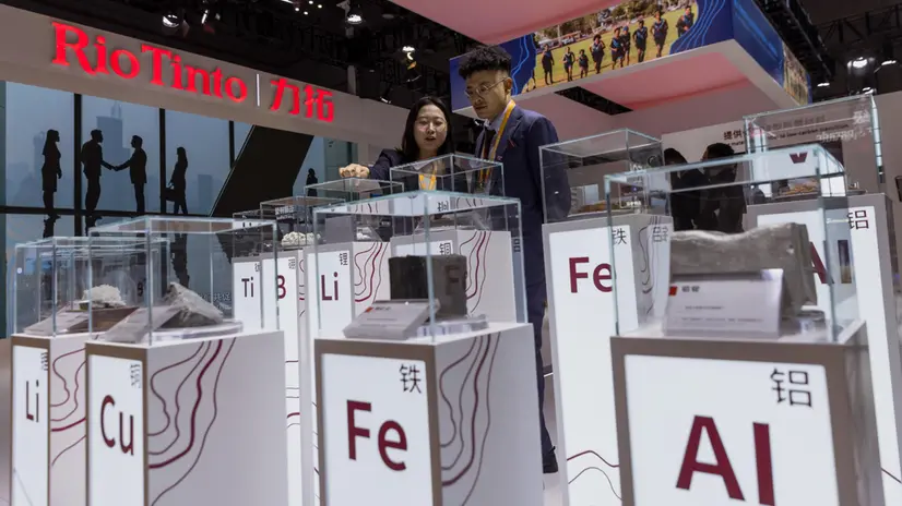 epa10958967 People watch exhibited minerals at the Rio Tinto booth at the China International Import Expo in Shanghai, China, 05 November 2023. The China International Import Expo (CIIE) in Shanghai runs from 05 to 10 November 2023. EPA/ALEX PLAVEVSKI
