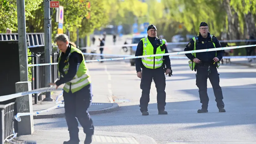 epa12064241 Police at the scene the day after after a shooting at Vaksala Square in central Uppsala, Sweden, 30 April 2025. According to police, three people were confirmed dead after a shooting on 29 April, which is being investigated as a murder. EPA/FREDRIK SANDBERG SWEDEN OUT