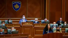 epa09116004 Newly elected Kosovo President Vjosa Osmani delivers a speech to the delegates after she was sworn-in at the parliament in Pristina, Kosovo, 04 April 2021. EPA/VALDRIN XHEMAJ