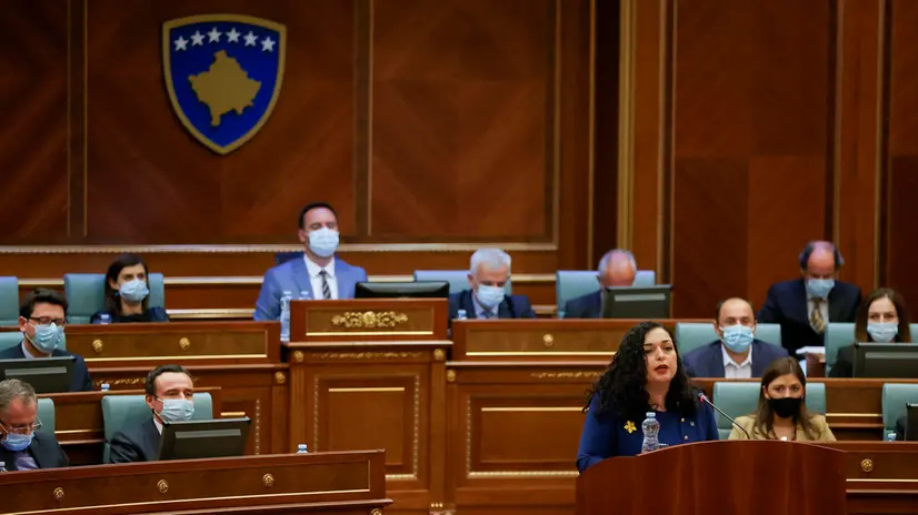 epa09116004 Newly elected Kosovo President Vjosa Osmani delivers a speech to the delegates after she was sworn-in at the parliament in Pristina, Kosovo, 04 April 2021. EPA/VALDRIN XHEMAJ