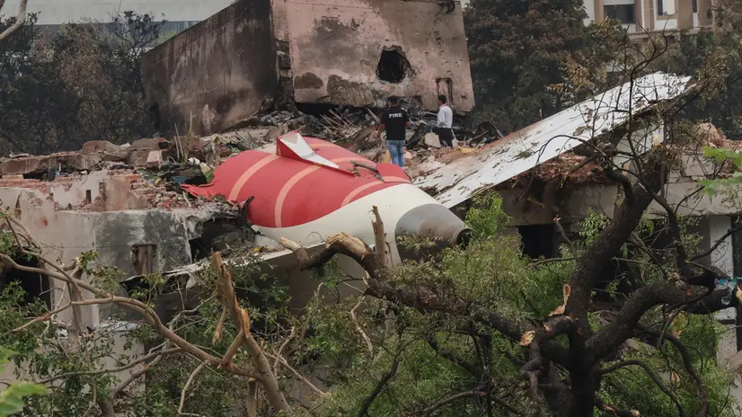 epa12172805 Officials inspects site of an airplane crash near Sardar Vallabhbhai Patel International Airport in Ahmedabad, Gujarat, western India, 13 June 2025. Air India flight AI171, bound for London carrying 242 passengers and crew members on board a Boeing 787-8 aircraft, crashed minutes after take-off in the Meghaninagar area of Ahmedabad. EPA/RAJAT GUPTA