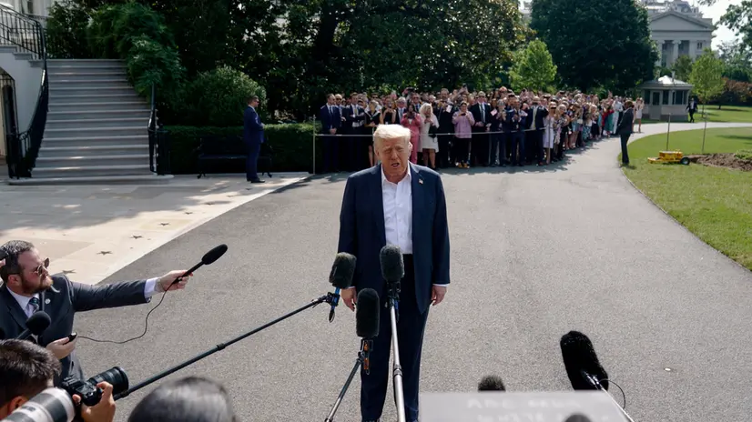 epa12232011 US President Donald Trump speaks to the media before leaving the White House on board Marine One, in Washington, DC, USA, 11 July 2025. President Trump and First Lady Melania Trump are due to visit Texas after flooding in Kerr County killed at least 121 people. EPA/WILL OLIVER