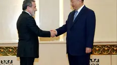 epa12238684 A handout photo made available by the Iranian Foreign Ministry shows Chinese President Xi Jinping greeting Iranian Foreign Minister Abbas Araghchi (L) during a meeting ahead of the Shanghai Cooperation Organization (SCO) summit in Tianjin, China, 15 July 2025. EPA/IRANIAN FOREIGN MINISTRY HANDOUT HANDOUT EDITORIAL USE ONLY/NO SALES
