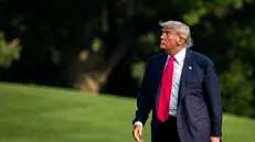 epa12240014 US President Donald Trump walks on the South Lawn of the White House after arriving on Marine One in Washington, DC, USA, 15 July 2025. Trump hailed more than $92 billion US dollars in investments in artificial intelligence and energy infrastructure during a visit to Pennsylvania, highlighting his efforts to bolster US competitiveness in the AI field. EPA/Al Drago / POOL