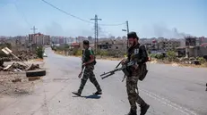 epaselect epa12240523 Syrian security forces deploy amid ongoing clashes in the southern city of Sweida, 16 July 2025. Damascus deployed troops in the predominantly Druze province of Sweida after clashes between Druze fighters and Bedouin tribes resulted in the death of dozens of people. The Syrian Defense Minister announced a ceasefire on July 15 in the city of Sweida, which Syrian troops entered in the morning, but the area is witnessing violent clashes between government forces and Druze militants. EPA/MOHAMMED AL RIFAI