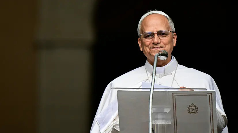Pope Leo XIV addresses the crowd for the Angelus prayer in Piazza della Liberta (Liberty Square) in front of Palazzo Apostolico (Apostolic Palace) in the summer papal estate in Castel Gandolfo, 40 km southeast of Rome, on July 13, 2025. - The newly elected Pope Leo XIV, takes a summer break from July 6 to 20 at the papal palace at Castel Gandolfo, outside Rome, a longtime country residence for pontiffs that Francis declined to use. (Photo by Tiziana FABI / POOL / AFP)