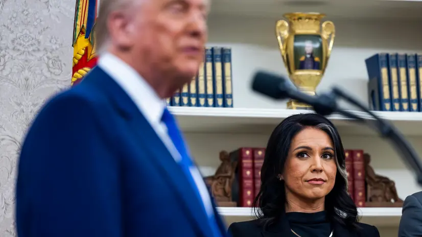 epa11891819 US President Donald Trump's Director of National Intelligence Tulsi Gabbard (R) looks on as President Trump speaks in the Oval Office of the White House in Washington, DC, USA, 12 February 2025. Former Senate Minority Leader Mitch McConnell was the only Republican Senator to vote against her nomination. EPA/JIM LO SCALZO / POOL