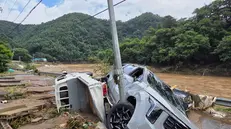 epa12248767 Damaged vehicles following heavy rains in the northern county of Gapyeong, South Korea, 20 July 2025. EPA/YONHAP SOUTH KOREA OUT