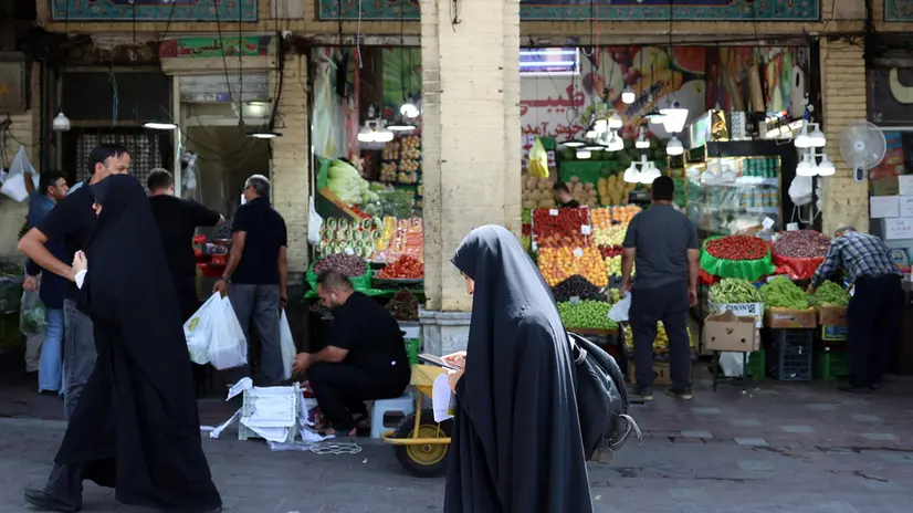 epa12205864 Iranians walk past shops in the Tajrish bazaar in Tehran, Iran, 30 June 2025, amid a ceasefire with Israel. Israel had conducting a campaign across Iran since 13 June, targeting nuclear, military, and energy facilities, prompting Iran to launch retaliatory waves of missiles and drones toward Israel. A ceasefire ended their 12-day armed conflict. EPA/ABEDIN TAHERKENAREH