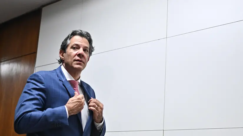 epa12239595 Brazilian Finance Minister Fernando Haddad walks out of a press conference in Brasilia, Brazil, 15 July 2025. The inter-ministerial committee created by Brazilian President Luiz Inacio Lula da Silva to respond to the 50 percent tariff announced by the United States government is meeting for the first time with representatives of the industry and agricultural sectors. EPA/ANDRE BORGES