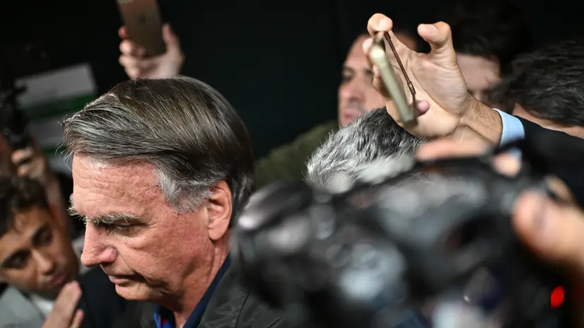 epa12252103 Former Brazilian President Jair Bolsonaro walks out of a meeting with opposition congress members at the National Congress in Brasilia, Brazil, 21 July 2025. EPA/Andre Borges