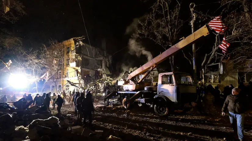 epa10443578 Ukrainian rescuers work on site following a rocket attack on a residential building in the city of Kramatorsk in the Donetsk area, Ukraine, 01 February 2023 amid the Russian invasion. At least two people were killed and seven injured, according to Pavlo Kyrylenko, Head of the Donetsk Regional Military Administration. Russian troops entered Ukraine on 24 February resulting in fighting and destruction in the country and triggering a series of severe economic sanctions on Russia by Western countries. EPA/YEVGEN HONCHARENKO
