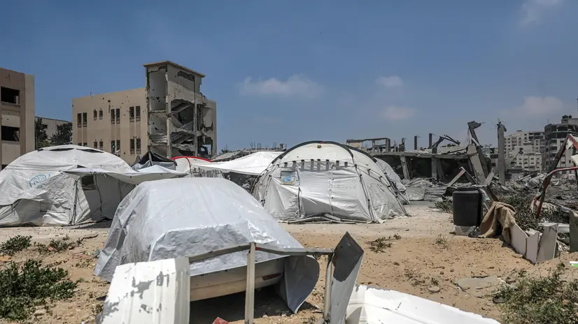 epa12127873 Tents of internally displaced Palestinian people stand near a destroyed building following an Israeli airstrike west of Gaza City, in Gaza Strip, 23 May 2025. More than 53,700 Palestinians have been killed in the Gaza Strip, according to the Palestinian Ministry of Health, since Israel launched a military campaign in the strip in response to a cross-border attack led by the Palestinian militant group Hamas on 07 October 2023, in which about 1,200 Israelis were killed and more than 250 taken hostage. EPA/MOHAMMED SABER