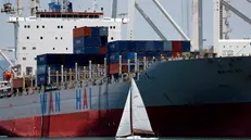 epa12238229 A sailboat passes the starboard side of a container ship being unloaded at the Port of Oakland in Oakland, California, USA, 14 July 2025. Recent tariff increases and trade policies, particularly those related to China, have significantly affected the port’s operations and container volume. Shipping lines have been canceling voyages and skipping ports (known as 'blank sailings') in response to the uncertainty and reduced demand caused by tariffs, leading to a decline in container traffic at the Port of Oakland. Last week, US President Trump sent a letter to European Union leaders stating that he would impose a 30 percent tariff on goods imported from the EU beginning 01 August. Trump also threatened to impose 25 percent tariffs on Japan and South Korea, 30 percent on Mexico, and 35 percent on Canada. EPA/JOHN G. MABANGLO