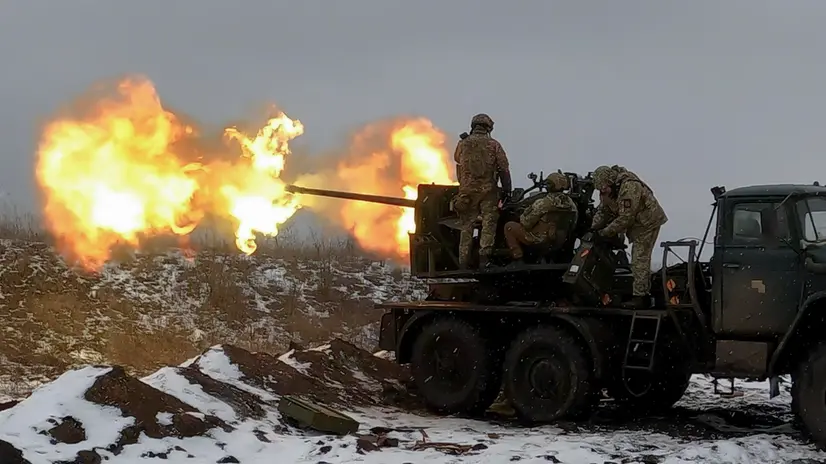epa10447981 Ukrainian soldiers fire an anti-aircraft gun at a position near Bakhmut, Donetsk region, eastern Ukraine, 04 February 2023, amid Russia's invasion. Ukrainian servicemen have mounted a Soviet-era S-60 anti-aircraft gun on a truck for better mobility and fighting performance. The front-line city of Bakhmut, a key target for Russian forces, has seen heavy fighting for months. Russian troops on 24 February 2022, entered Ukrainian territory, starting a conflict that has provoked destruction and a humanitarian crisis. EPA/SERGEY SHESTAK