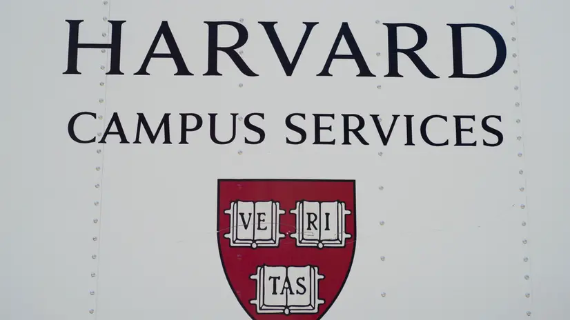 epa12139452 The Harvard University crest adorns the side of a campus services vehicle on the Harvard University campus in Cambridge, Massachusetts, USA, 27 May 2025. US President Trump has instructed all federal agencies to terminate all federal government contracts, estimated to be 100 million dollars (88.2 million euros) with Harvard and its affiliates. EPA/CJ GUNTHER