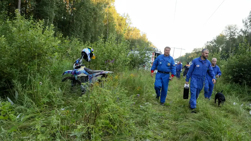 epa11475070 Russian rescuers inspect the wreckage site of a Russian Sukhoi Superjet 100 that crashed near the village of Apraksino, in Moscow region, Russia, 12 July 2024. A Sukhoi Superjet 100 plane crashed in a forest near the village of Apraksino near Kolomna. According to preliminary information, the two pilots and a navigator on board the plane died in the crash. The aircraft was flying without passengers, the Moscow Interregional Transport Prosecutor's Office reports. EPA/MAXIM SHIPENKOV