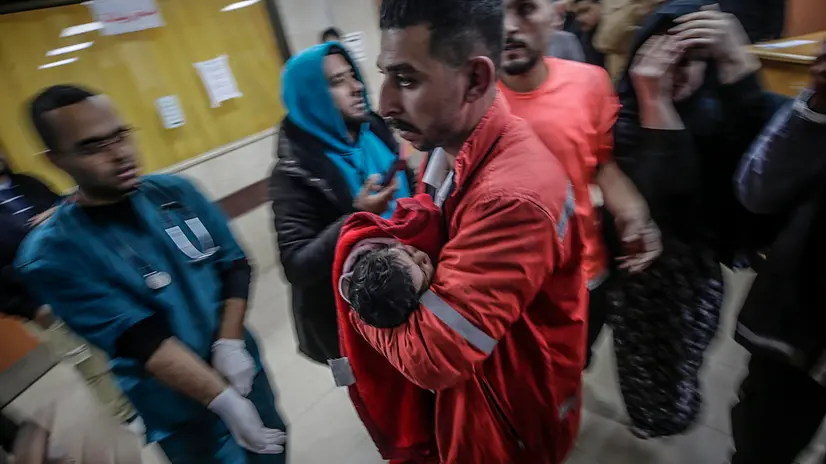 epa11812142 A wounded Palestinian baby is taken to Al Aqsa hospital following an Israeli air strike on Al Bureije refugee camp, in Deir Al Balah town, central Gaza Strip, 07 January 2025. More than 45,800 Palestinians and over 1,400 Israelis have been killed, according to the Palestinian Health Ministry and the Israeli Army, since Hamas militants launched an attack against Israel from the Gaza Strip on 07 October 2023, and the Israeli operations in Gaza and the West Bank which followed it. EPA/MOHAMMED SABER ATTENTION EDITORS: GRAPHIC CONTENT