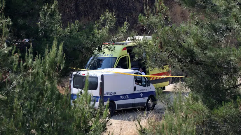 epa07643860 Cyprus police van and an ambulance wait at the scene of a search operation for bodies of victims of a killer, near the village of Xiliatos, Cyprus, 12 June 2019. TA Cyprus police official says divers searching the bottom of a lake have discovered the remains of what authorities believe to be the remains of a 6-year-old girl that a serial killer has confessed to killing. The remains are thought to be the 7th and final victim of a 35-year-old Cyprus army captain. EPA/KATIA CHRISTODOULOU