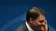 epa10443285 Senator Flavio Bolsonaro, son of former President Jair Bolsonaro, attends the plenary session of the National Congress of Brazil during the inauguration of the new deputies and senators, in Brasilia, Brazil, 01 February 2023. The Brazilian National Congress inaugurates the new legislative year on 01 February with a mostly conservative composition, which came out of the polls last October, in the same process in which Lula defeated the far-right Jair Bolsonaro. EPA/Andre Borges