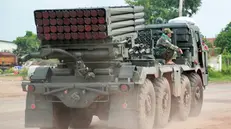 epa12259906 Cambodian soldiers ride on a self-propelled multiple rocket launcher in Oddar Meanchey province, Cambodia, 25 July 2025. Cambodian troops took position near the front line during fighting with Thai forces over a disputed border zone. EPA/KITH SEREY