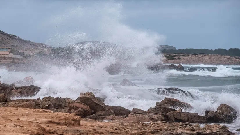 epa08633362 Rough waves break on the rocks on a windy day in Bou beach in Sant Josep de Sa Talaia in Ibiza, Balearic Islands, Spain, 29 August 2020. Orange and yellow warnings have been issued in Balearic islands due to rain and thunderstorms expected throughout the day. EPA/Sergio G. CaÃ±izares