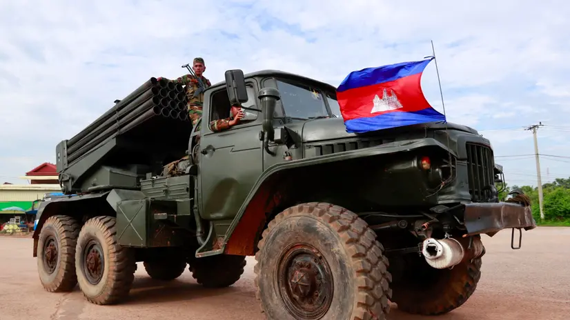 epa12259908 Cambodian soldiers ride on a self-propelled multiple rocket launcher in Oddar Meanchey province, Cambodia, 25 July 2025. Cambodian troops took position near the front line during fighting with Thai forces over a disputed border zone. EPA/KITH SEREY
